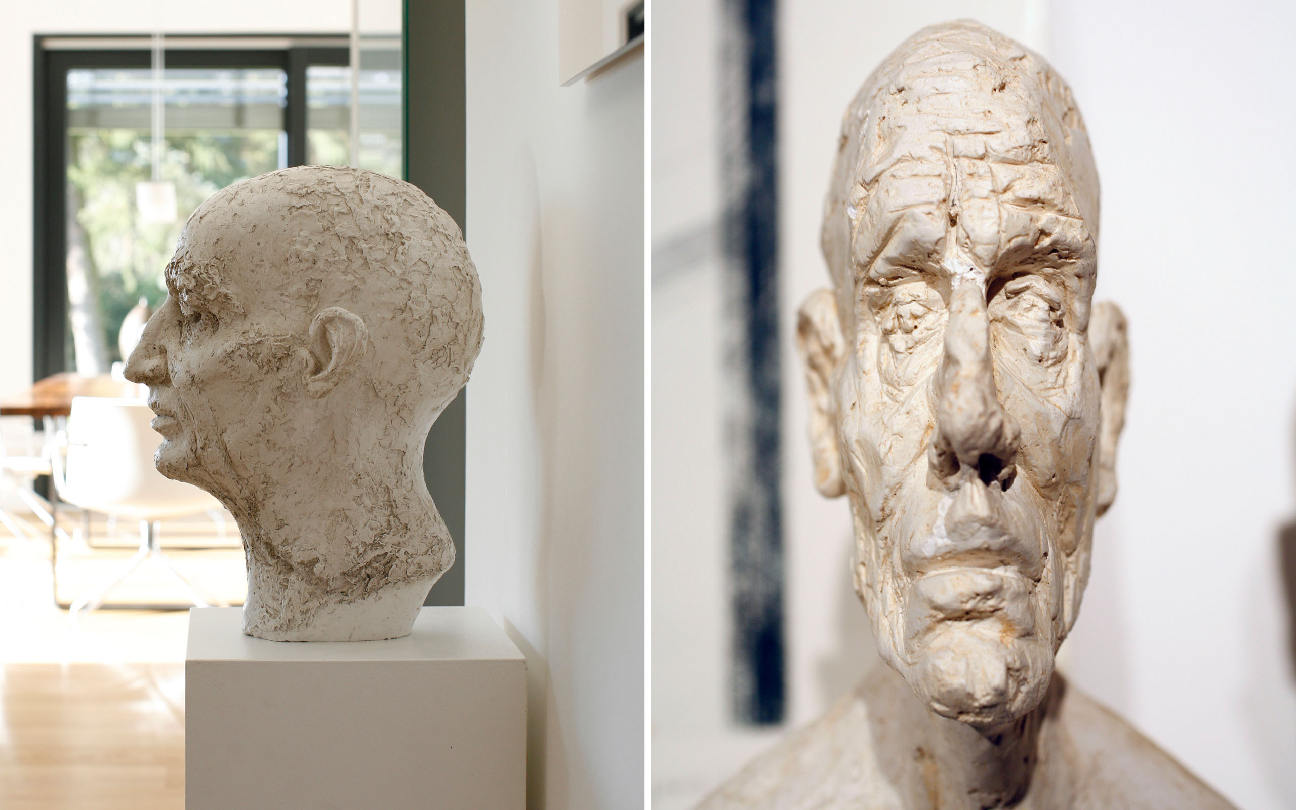 Leben mit Kunst – Skulpturenpaar: zwei plastische Köpfe im Wohnraum